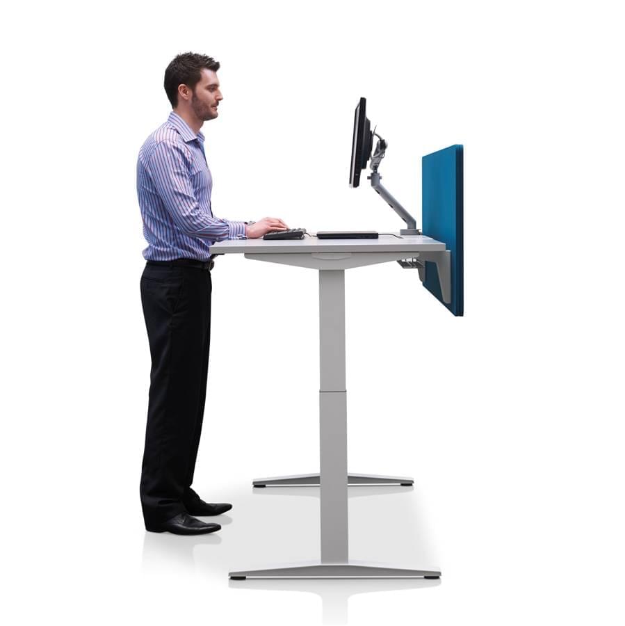 herman miller ratio desk man standing in front of desk